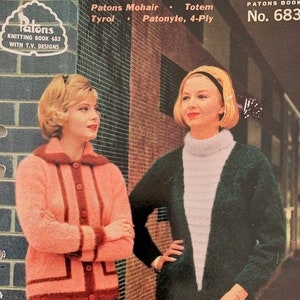 May include: Vintage knitting book cover featuring two women in knitted sweaters. The woman on the left wears a pink cardigan with dark red trim, paired with a green skirt. The woman on the right wears a dark green cardigan over a white turtleneck and light gray pants. The book title is "Patons Knitting Book 683".