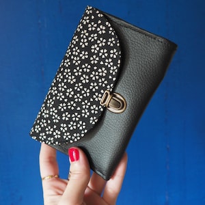Women's purse with satchel attachment in black faux leather and Japanese flower print fabric