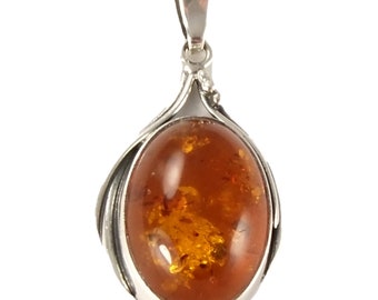 Solid sterling silver and natural amber pendant
