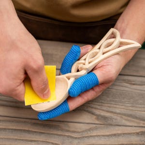 Complete whittling kit for crafting a traditional Celtic love spoon at home.