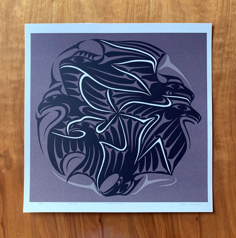 May include: A black and white print of a stylized design featuring three overlapping birds with wings spread. The print is on a purple background and has the text "Northwest Artists" at the bottom.
