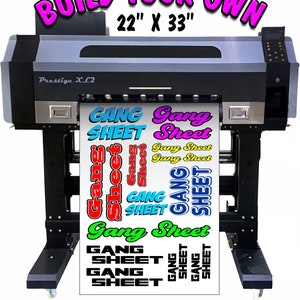 May include: A large format printer with a roll of vinyl printed with the words "Gang Sheet" in various colors and fonts. The printer is labeled "Prestige XL2" and the text "Build Your Own 22" x 33" is displayed above the printer.