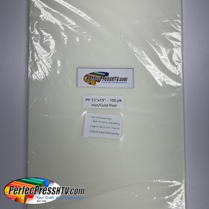 May include: A white sheet of 13" x 19" heat transfer vinyl, packaged in a clear plastic bag. The label on the bag reads "PP 13"x19" - 100 pk. Hot/Cold Peel" and includes instructions for using the vinyl.
