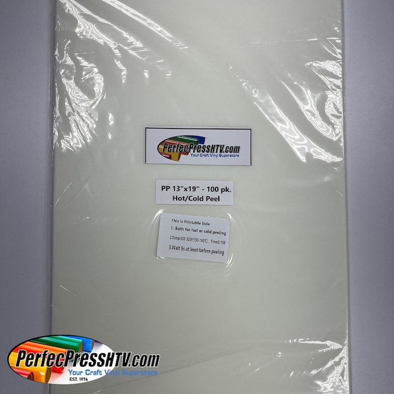 May include: A white sheet of 13" x 19" heat transfer vinyl, packaged in a clear plastic bag. The label on the bag reads "PP 13"x19" - 100 pk. Hot/Cold Peel" and includes instructions for using the vinyl.