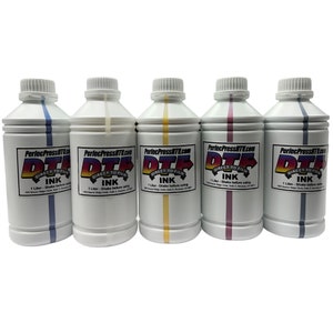 May include: Five 1-litre bottles of direct-to-film ink. The bottles are white with a black and red label that says "PerfecPressITL.com DTF DIRECT TO FILM INK 1 Litre - Shake before using". The bottles are labelled with different colours: blue, white, yellow, pink, and grey.