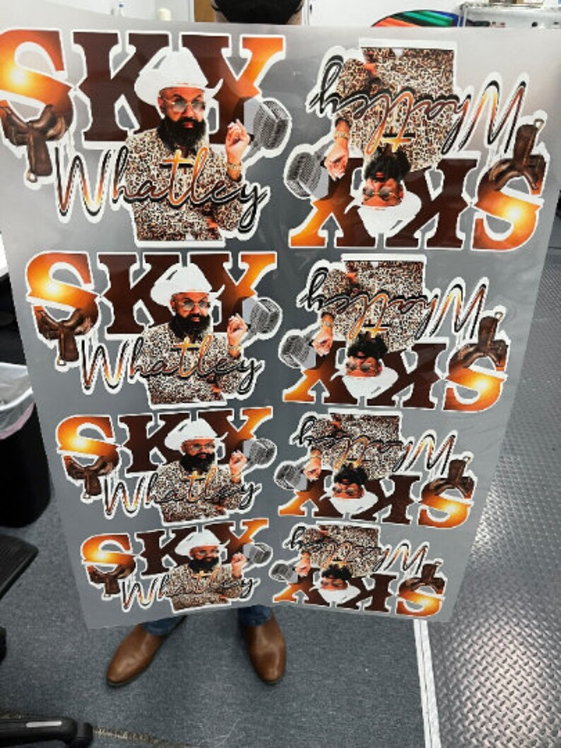 May include: Four sheets of stickers with a man wearing a leopard print shirt and a white cowboy hat. The stickers feature the text "Sky Whatley" and "Happy Mother's Day" in a gold and brown color scheme.