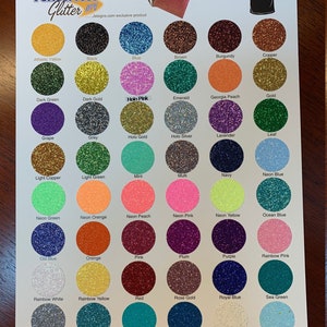 May include: A color chart for PerfectPress Glitter HTV, featuring a variety of glitter colors. The chart includes colors like Athletic Yellow, Black, Blue, Brown, and many more. The text "Heat at 300 degrees for 12-15 seconds, Peel Warm" is also visible.