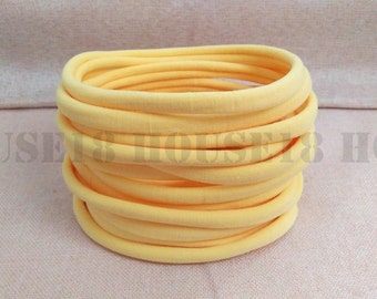 Nylon diadema amarillo diadema a granel diadema un tamaño se adapta a la mayoría elástica flaco suave DIY bebé recién nacido diadema al por mayor