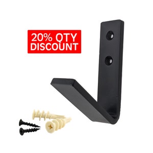 May include: Black metal L-shaped wall mount hook with two screw holes. The hook is attached to a white background. Two screws are included.