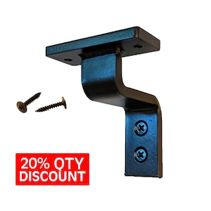 May include: Black metal bracket with two screw holes. The bracket has a curved shape and is designed to be mounted to a wall or other surface. Two screws are included.