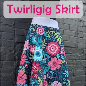 May include: A floral print skirt with a white waistband. The skirt features a dark background with large pink, blue, and green flowers. The text "Twirligig Skirt" is at the top, and a "Slice of Pi Quilts" logo is at the bottom.