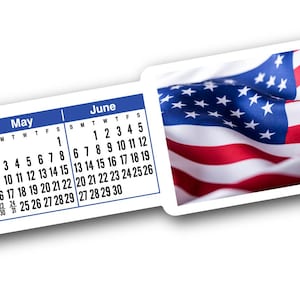 May include: A horizontal wall calendar strip featuring a blue and white grid for the months of February through August. The center section displays a prominent, waving American flag with red, white, and blue colors and the text deSIGNerySigns.com.