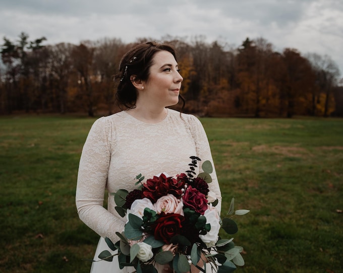 Lace bodysuit with long sleeves and low back with a tulle skirt
