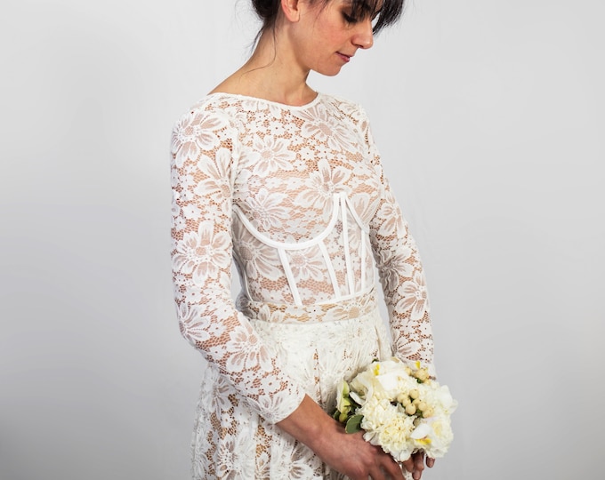 Bridal corset on lace bodysuit and lace skirt