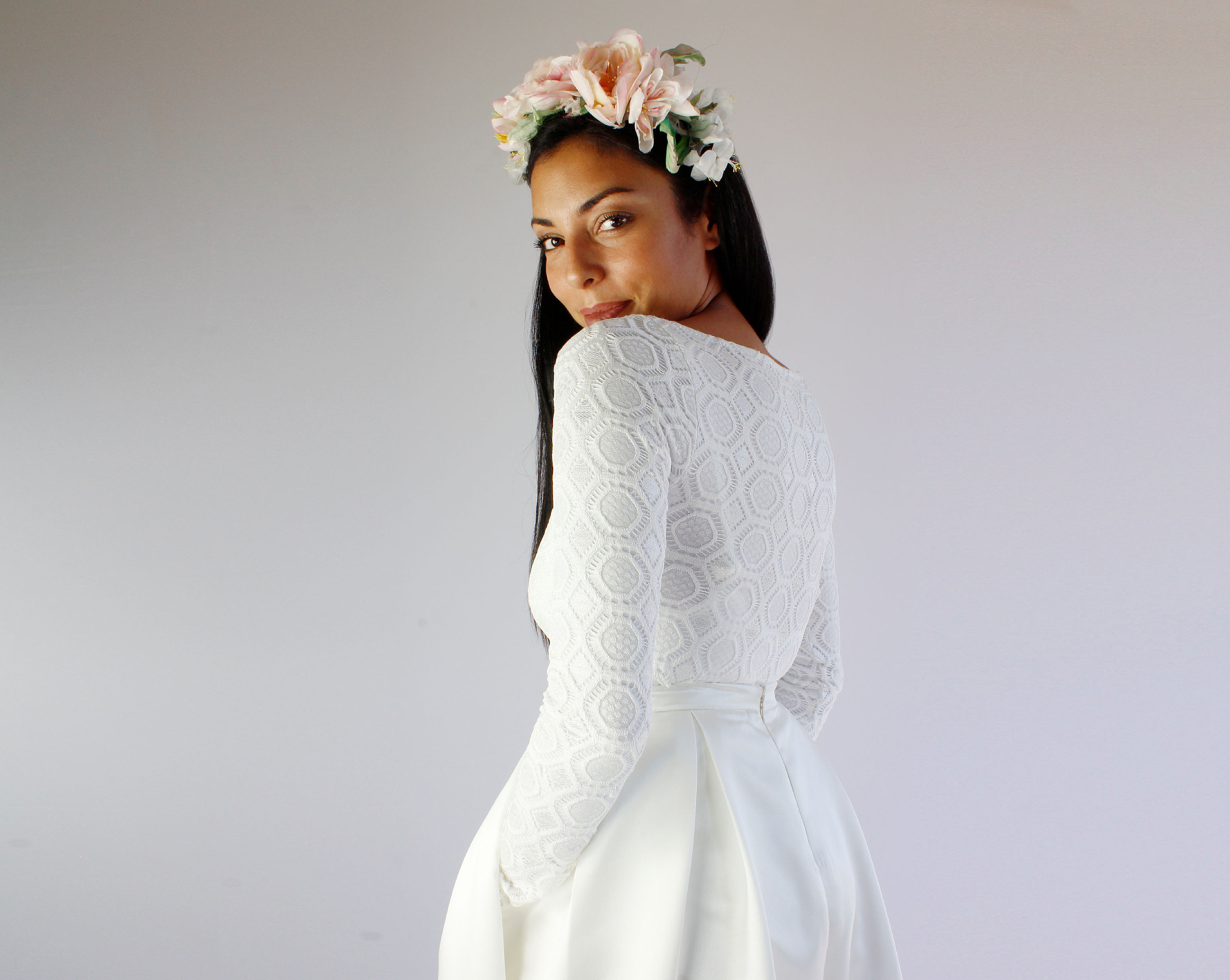 Simple two pieces wedding dress composed by a lace bridal bodysuit with  long sleeves and a satin skirt with pockets