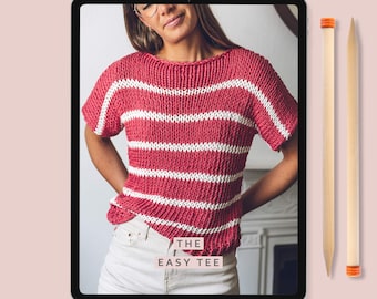 May include: A digital tablet displaying a knitting pattern for a striped red and white tee shirt. The pattern is titled "The Easy Tee" and is by Lauren Acton Designs. Two wooden knitting needles are shown to the right of the tablet.