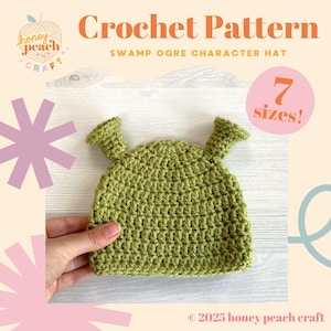May include: A green crocheted Swamp Ogre character hat. The hat has two small, upright ear-like protrusions. The text "Crochet Pattern" and "SWAMP OGRE CHARACTER HAT" are displayed above the hat. The text "7 sizes!" is in a pink circle.