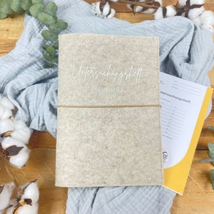 Manchon U-stitch personnalisé | Beige | Couverture du livret d’examen avec nom et date de naissance