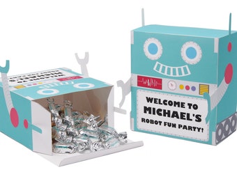 May include: A blue and white robot-shaped party favor box with a white lid and a red and white robot face. The box is open and filled with silver wrapped candies. The box has the text "Welcome to Michael's Robot Fun Party!" printed on the front.