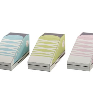 May include: Three shoe-shaped boxes made of cardboard. The boxes are in the shape of a sneaker with laces and a white sole. The boxes are blue, green, and pink.