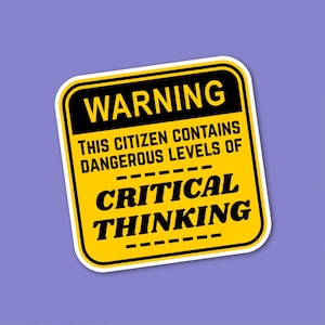 May include: A yellow and black warning sticker with the text "WARNING" at the top. Below, it reads "THIS CITIZEN CONTAINS DANGEROUS LEVELS OF CRITICAL THINKING" in bold, black font. The sticker has a rounded rectangular shape and a purple background.