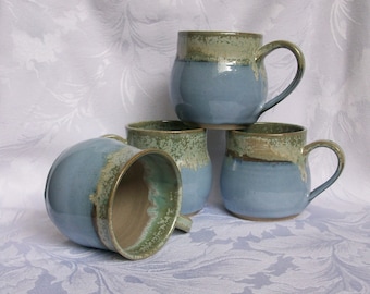 Set of 4 blue and mint, round bellied coffee mugs.