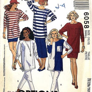 May include: A vintage McCall's sewing pattern envelope featuring illustrations of various tunic and top designs. The cover showcases multiple women modeling different styles, including striped and color-blocked tops. The pattern number is 6058, size small.