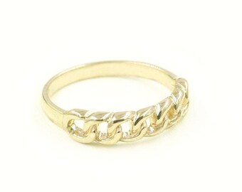 May include: A gold chain link ring. The ring is made of a thick, textured chain link design.