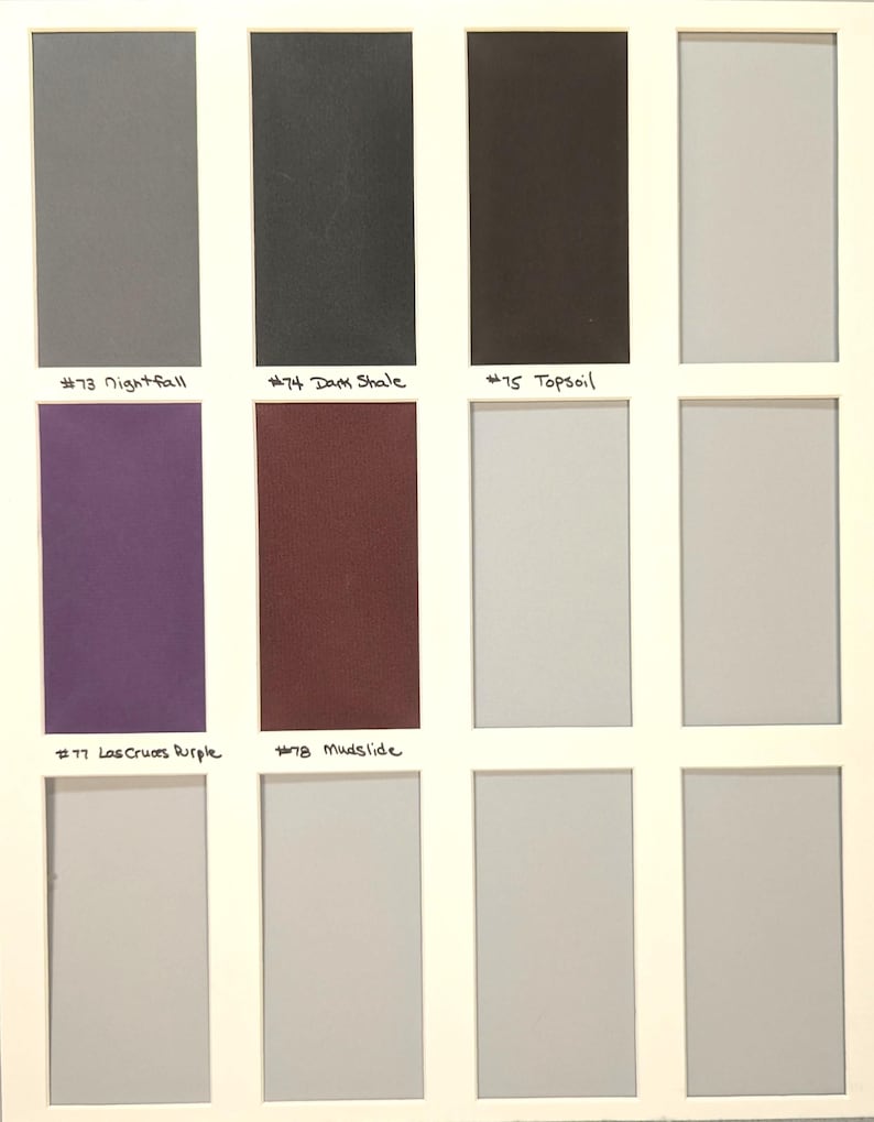May include: A color swatch grid featuring twelve rectangular samples arranged in a four-by-three layout. Labeled colors include #73 Nightfall, #74 Dark Shale, #75 Topsoil, #77 Las Cruces Purple, and #78 Mudslide, alongside several unlabeled neutral gray tones.