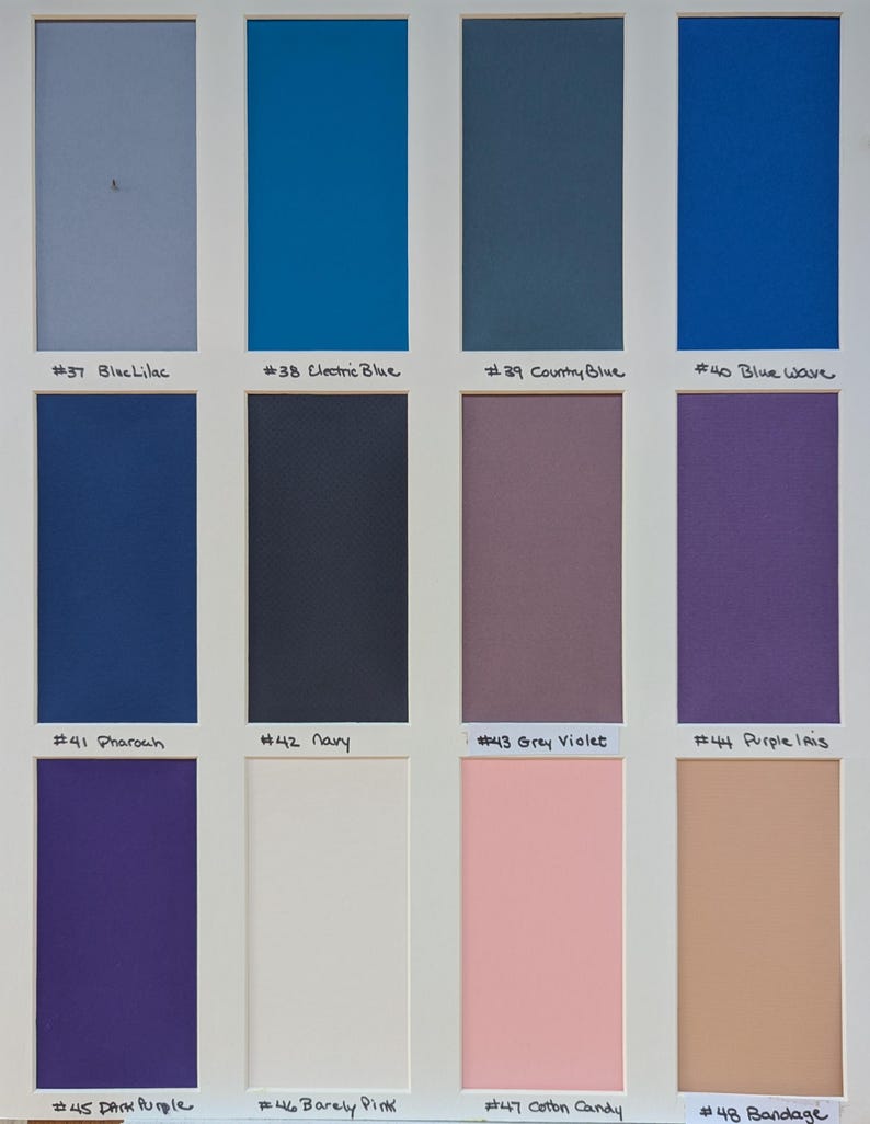 May include: A color swatch chart featuring twelve rectangular samples in a grid. Colors include Blue Lilac, Electric Blue, Country Blue, Blue Wave, Pharaoh, Navy, Grey Violet, Purple Iris, Dark Purple, Barely Pink, Cotton Candy, and Bandage.