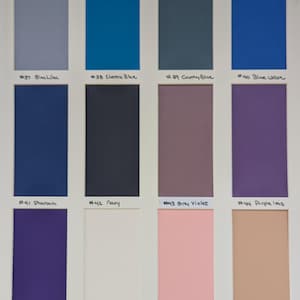 May include: A color swatch chart featuring twelve rectangular samples arranged in three rows of four. Each sample is labeled with a number and name: #37 Blue Lilac, #38 Electric Blue, #39 Country Blue, #40 Blue Wave, #41 Pharaoh, #42 Navy, #43 Grey Violet, #44 Purple Iris, #45 Dark Purple, #46 Barely Pink, #47 Cotton Candy, and #48 Bandage.