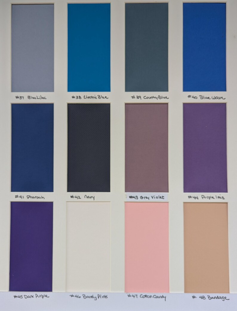 May include: A color swatch chart featuring twelve rectangular samples arranged in three rows of four. Each sample is labeled with a number and name: #37 Blue Lilac, #38 Electric Blue, #39 Country Blue, #40 Blue Wave, #41 Pharaoh, #42 Navy, #43 Grey Violet, #44 Purple Iris, #45 Dark Purple, #46 Barely Pink, #47 Cotton Candy, and #48 Bandage.