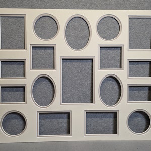 May include: A white mat board with 17 cut-out openings for photos or artwork. The openings are in various shapes, including squares, circles, ovals, and rectangles. The mat board has a subtle, light gray border around each opening.
