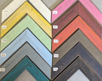 May include: A set of 10 chevron-shaped wooden picture frames in various colors, including white, yellow, green, sky blue, teal, gray, taupe, red, orange, and pink. Each frame has a distressed, rustic look.