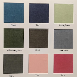 May include: A grid of nine fabric swatches labelled Teal, Navy, Spring Green, Williamsburg Green, Olive, Steel Drum, Slate, Pink, and Coral. Each square displays a distinct solid colour with a visible woven texture, arranged in a three-by-three layout.