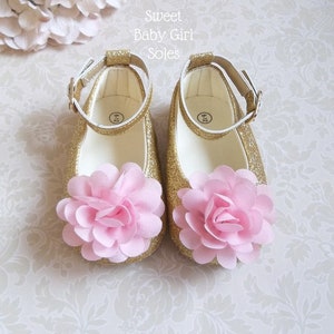 pink and gold baby shoes