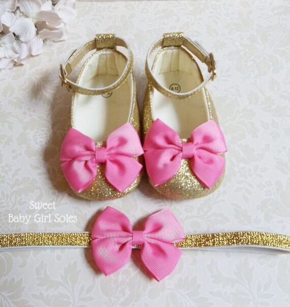 pink and gold baby shoes