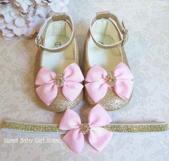 pink and gold baby shoes