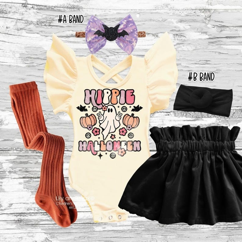 Complete Hippie Halloween outfit set laid out flat including cream leotard, black velvet skirt, rust tights, and two headbands on white wood.