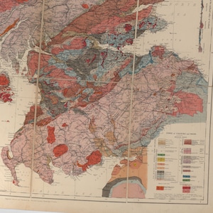 May include: A vintage geological map of Ireland, showing the different rock formations and their distribution across the country. The map is color-coded, with each color representing a different type of rock. The map also includes a key that explains the different colors and their corresponding rock types.