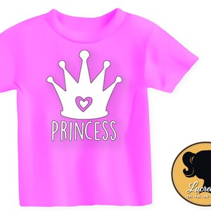 May include: Pink t-shirt with a white crown and the word "Princess" in white lettering.