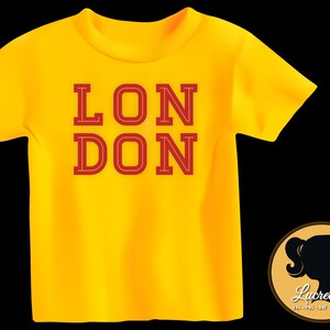 May include: Yellow t-shirt with the word "LONDON" printed in red.