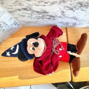 Plush Mickey Mouse Blue Wizard hat with stars, moon, tied robe, showing red pants white dots.