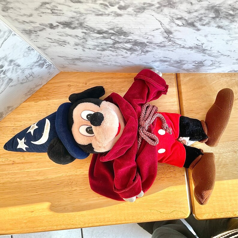 Plush Mickey Mouse Blue Wizard hat with stars, moon, tied robe, showing red pants white dots.