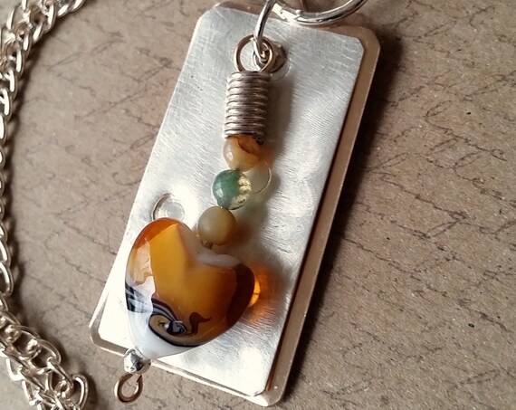 Silver and Bronze Pendant with Glass Heart