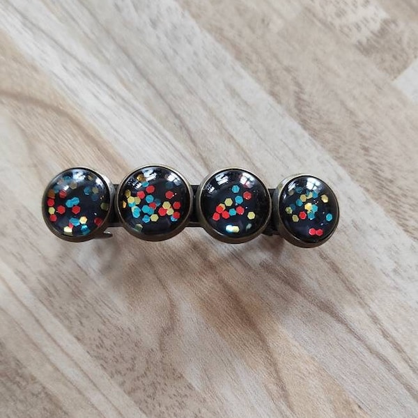 Barrette paillettes multicolores fond noir