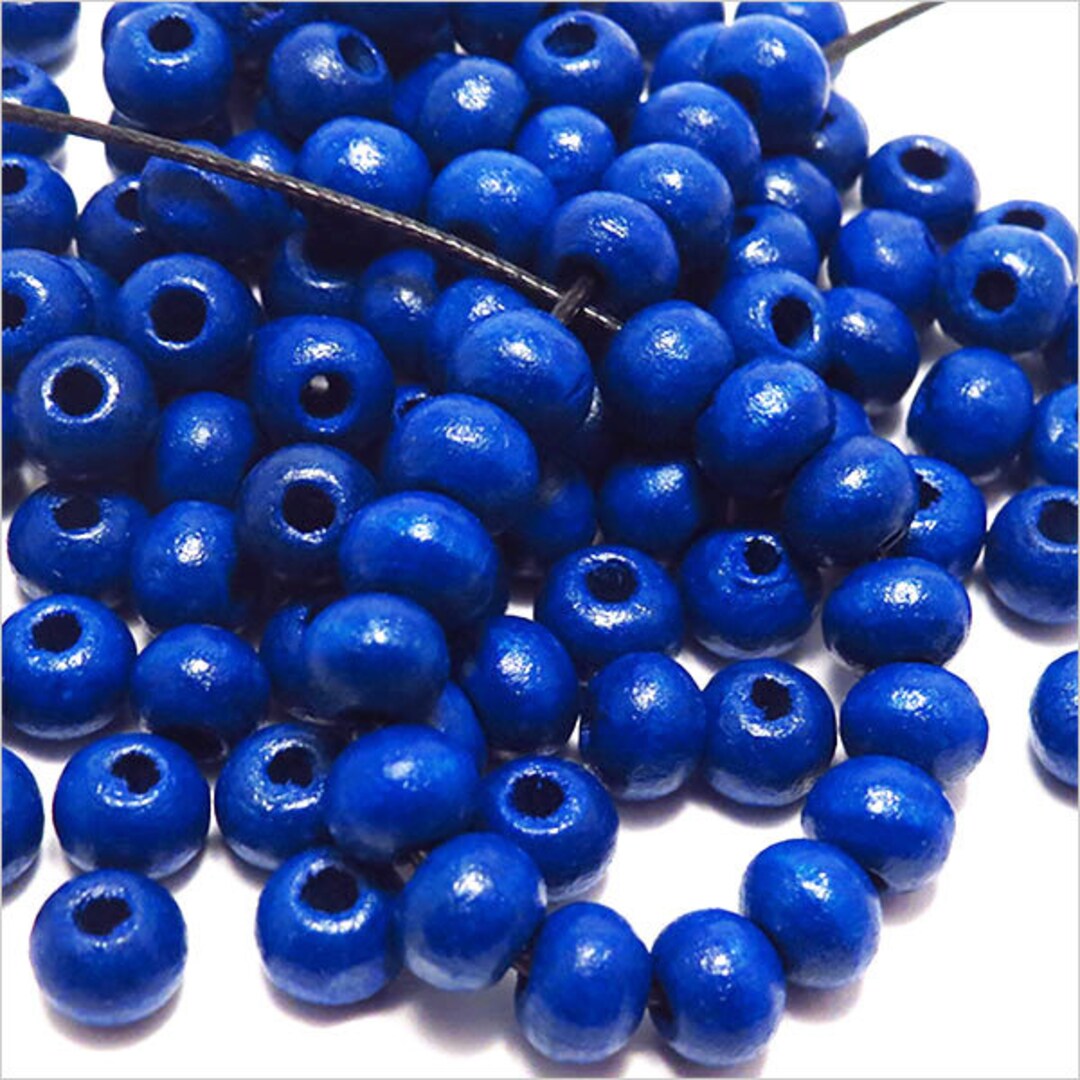 Perle en bois couleur bleue vente unitaire ronde 2 cm à enfiler pour jeux