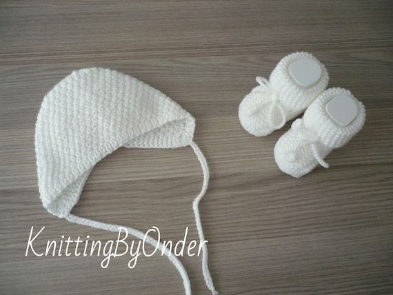 white knitted baby bonnet