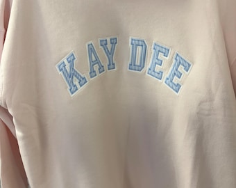 Kappa Delta Oversized Mock Neck pink sweatshirt   White Background and blue seersucker print Foreground letters. Super Soft!
