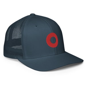 May include: A navy blue trucker hat with a red embroidered circle on the front.